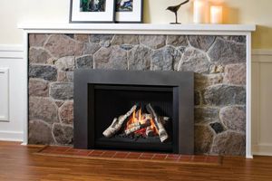 Valor G4 gas insert with birch logs in a stone masonry fireplace
